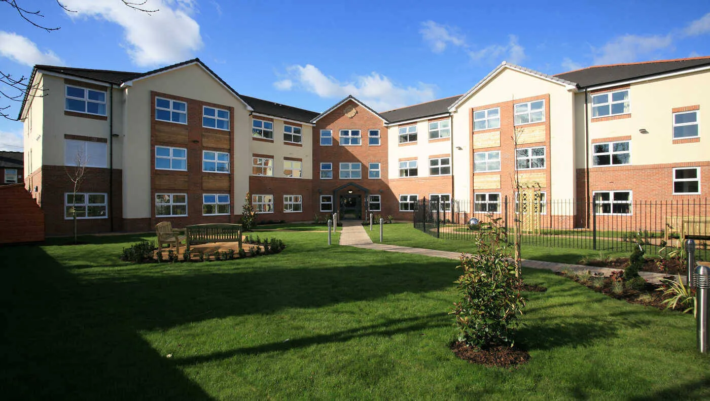 Welcoming UK care home with clean windows and tidy garden
