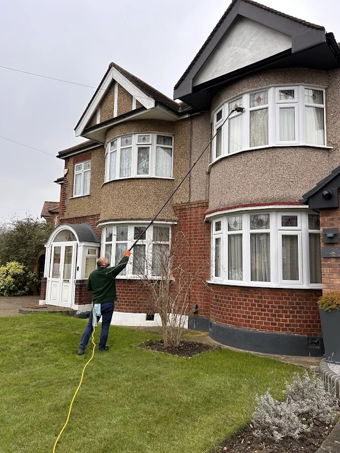 Window cleaning on large semi-detached residential property with bay windows